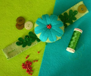 blue and green beaded flower wrist pincushion