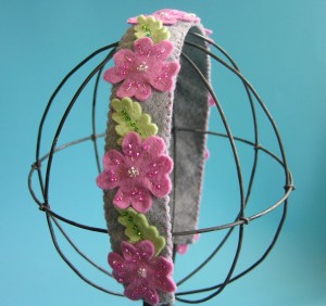 grey felt flower headband with beaded pink cherry blossom flowers